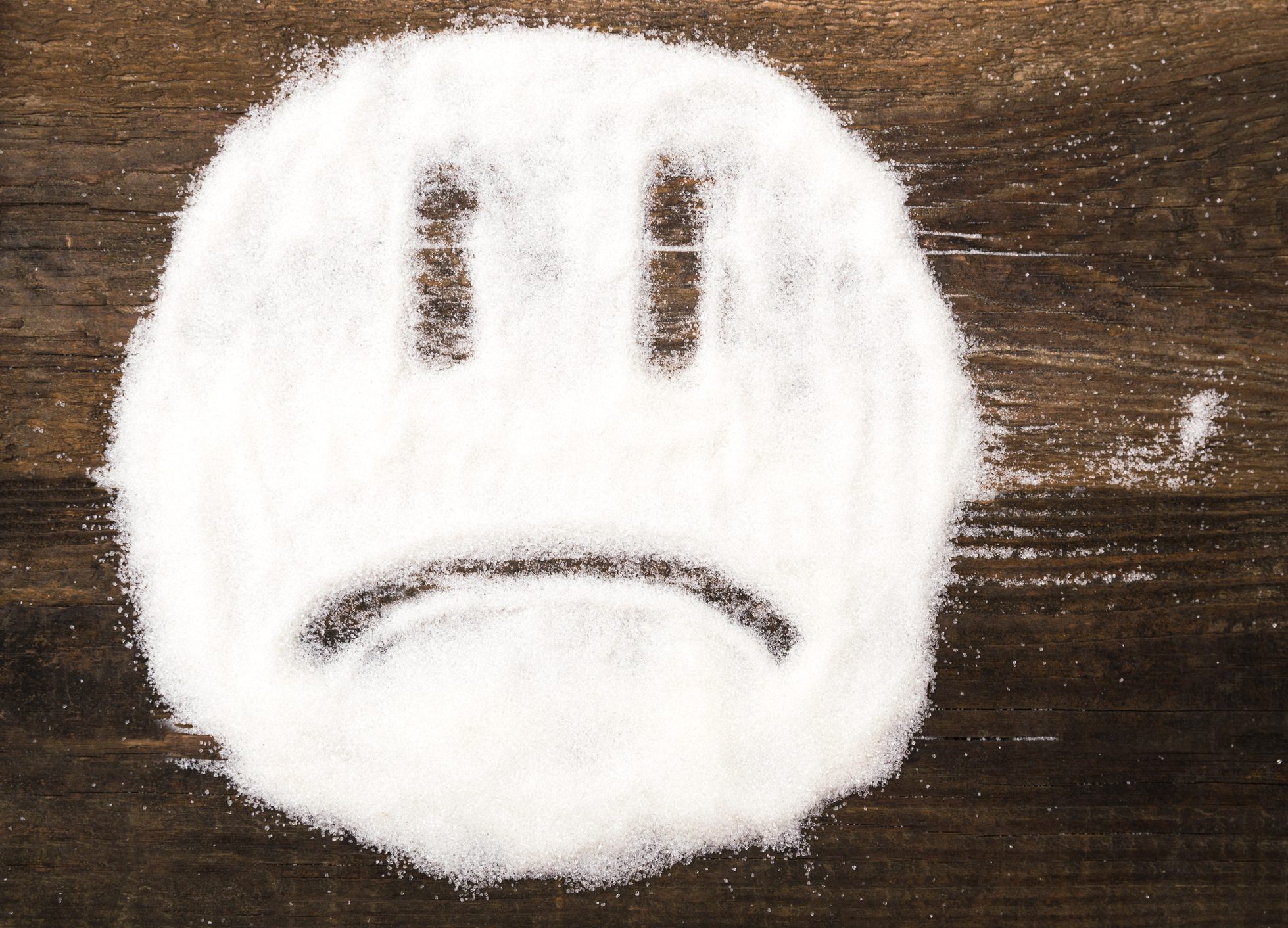 FUNIBER-face-of-a-sad-smiley-made-with-granulated-sugar