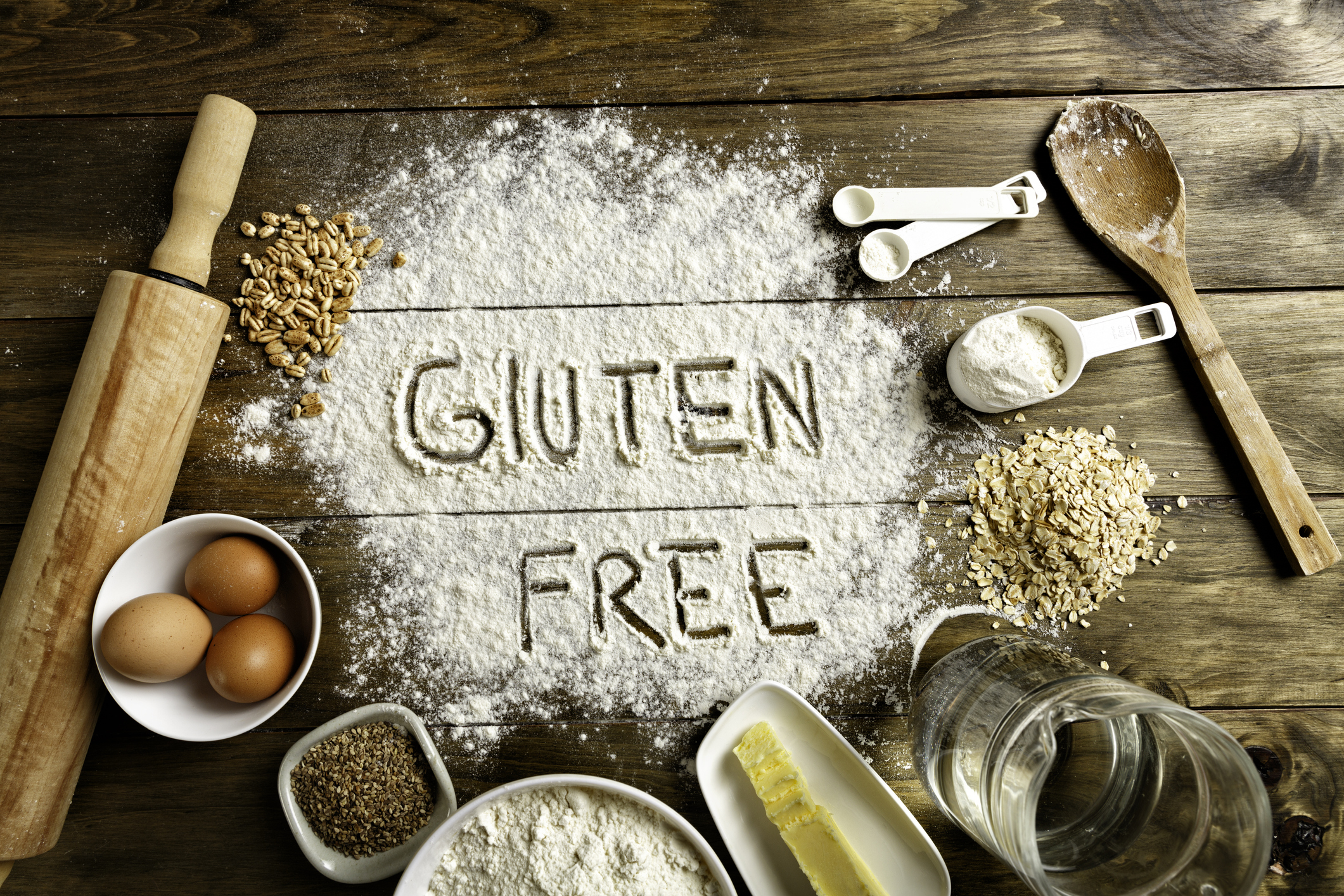 FUNIBER-gluten-free-bread-ingredients-and-utensils-on-wood-frame-background