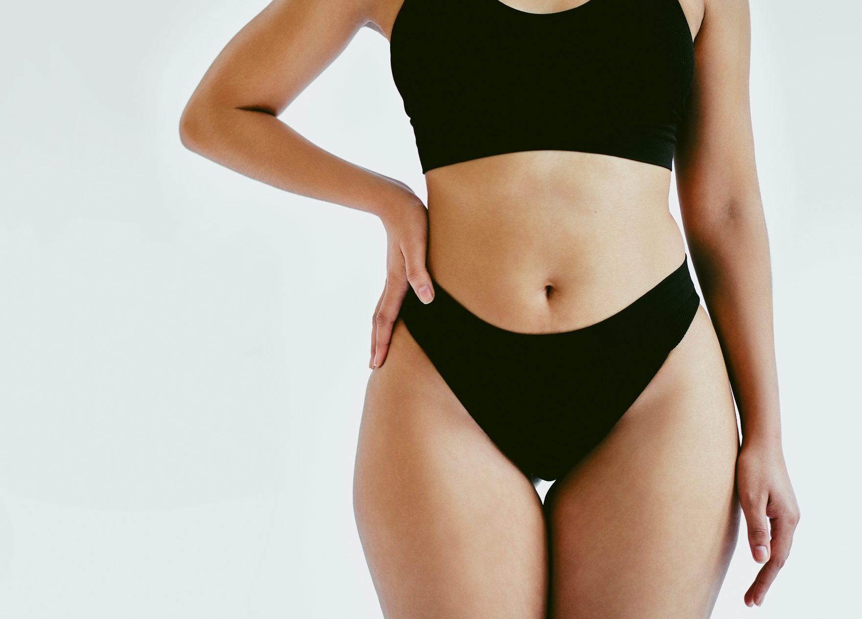 FUNIBER-healthy-curvy-woman-in-bikini-with-normal-body-and-for-summer-swimsuit-season-fit-black-girl-in-simple-swimwear-slim-stomach-and-hips-female-model-poses-for-body-positivity-fashion-and-wellness